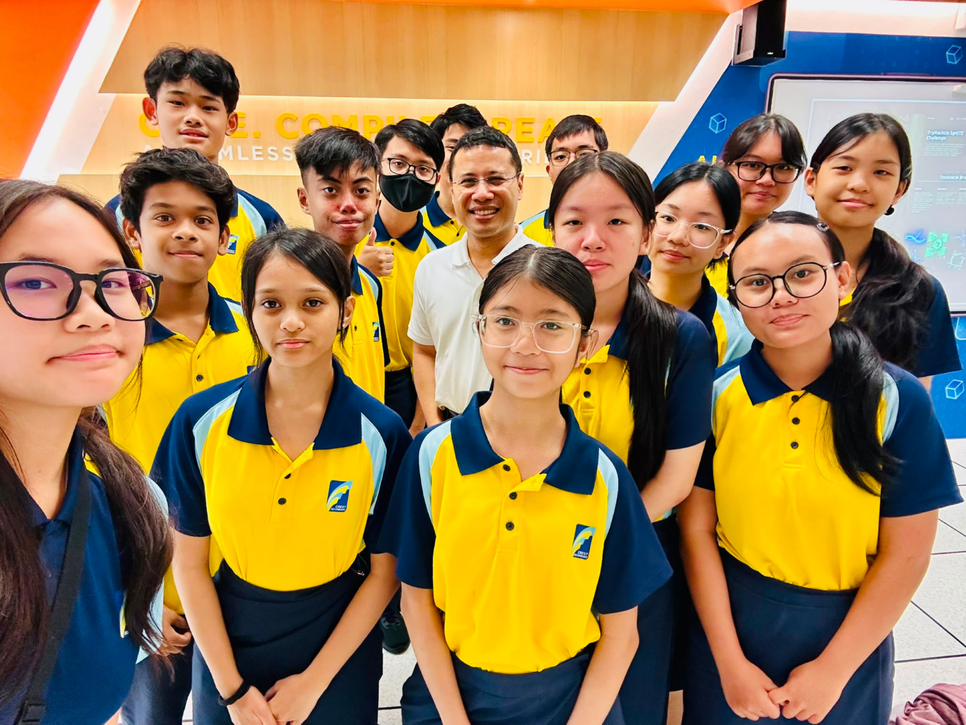Group picture of Minister Desmond Lee and Crest Sec students surrounding him